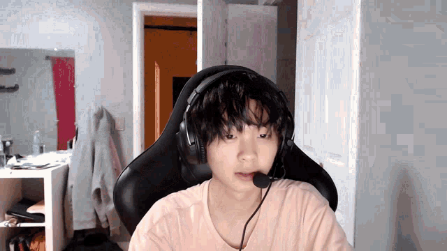 a young boy wearing headphones and a microphone