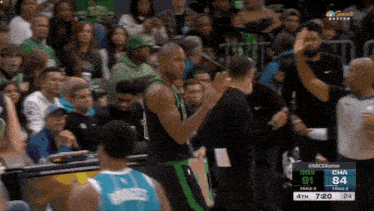 a basketball game between the boston celtics and the charlotte hornets is underway
