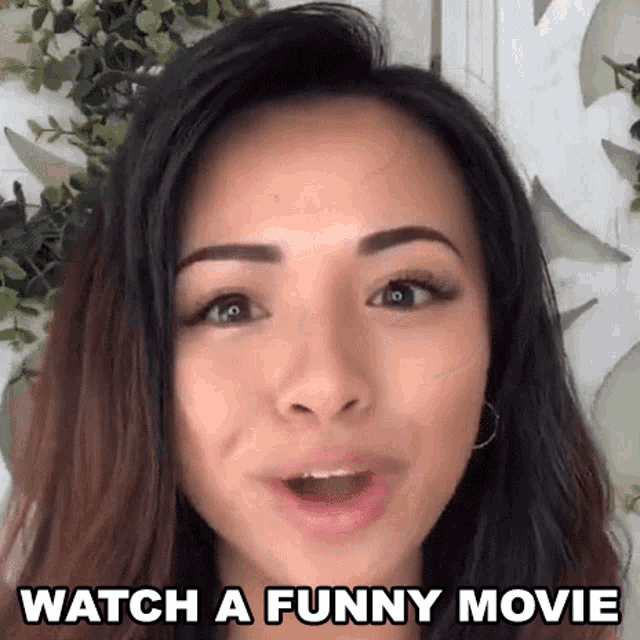 a woman is saying `` watch a funny movie '' .