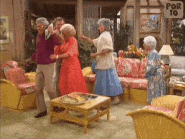 a group of people are dancing in a living room with a sign that says por 10 on it