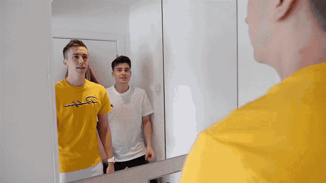 a man wearing a yellow shirt with the word champion on it