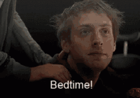 a man in a boxing ring with the word bedtime written on his face