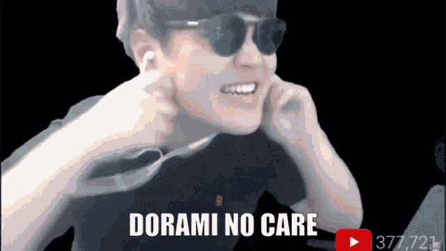 a man wearing sunglasses covering his ears with his hands and the words dorami no care above him