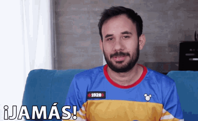 a man with a beard wearing a shirt that says 1928 on it