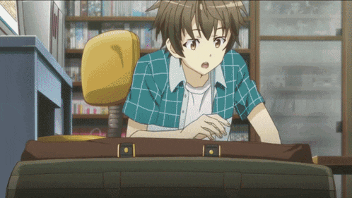 a boy in a plaid shirt is sitting at a desk