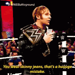 a man in a wrestling ring with the words " you wear skinny jeans that 's a huuuge mistake "