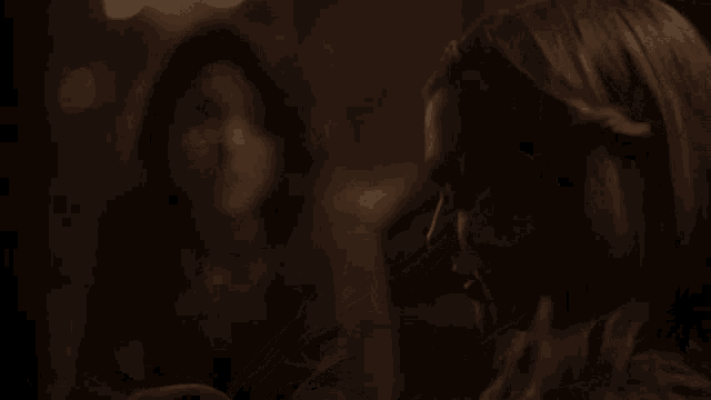 a woman is praying with her hands on her head while another woman looks on .