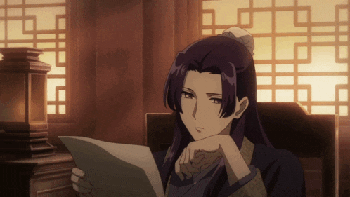 a woman with long purple hair is sitting in a chair reading a piece of paper
