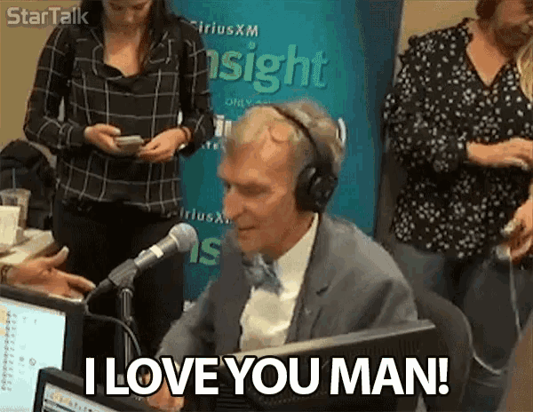 a man wearing headphones is sitting in front of a microphone and says i love you man .
