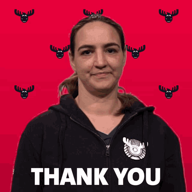 a woman wearing a black hoodie with a moose logo on it says thank you