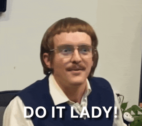 a man with glasses and a mustache is saying " do it lady "