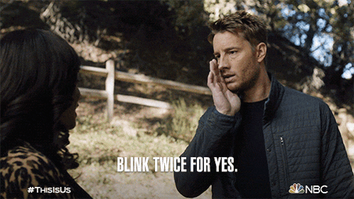 a man talking to a woman with the words blink twice for yes on the bottom