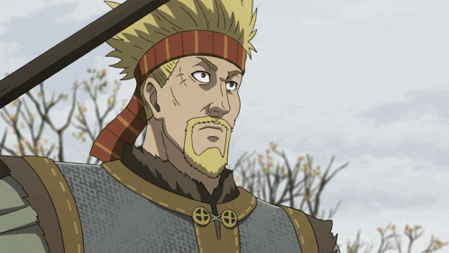 a man with a beard and a scarf around his head is holding a spear