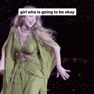 a woman in a green dress is dancing on a stage and the caption says girl who is going to be okay .