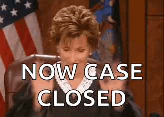 a judge is sitting in a courtroom with the words `` now case closed '' written on the screen behind her .