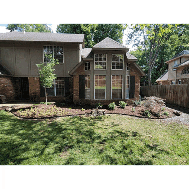 a brick house with a large bay window