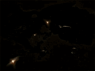 a drone is flying through a cloud of smoke in the dark .