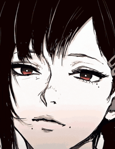 a close up of a person 's face with red eyes