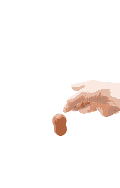 a person 's hand is reaching for an egg