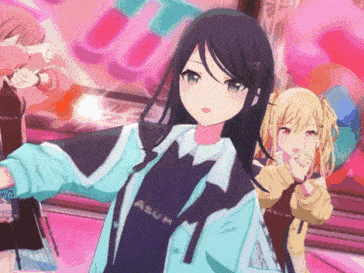 a girl in a blue jacket is standing next to another girl in a pink room .