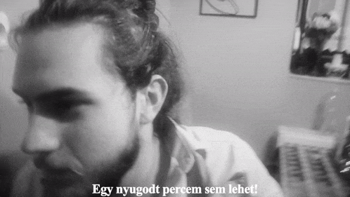 a black and white photo of a man with the words egy nyugodt percem sem lehet on the bottom