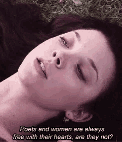 a woman laying in the grass with the words poets and women are always free with their hearts are they not written below her