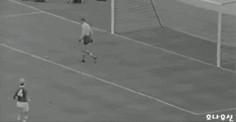 a black and white photo of a soccer game with a player wearing a number 3 jersey