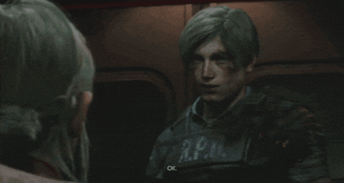 a man in a r.p.d. vest talks to another man