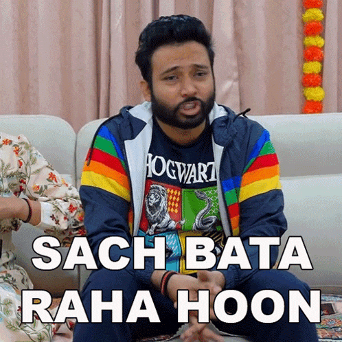 a man wearing a hogwarts shirt is sitting on a couch with a caption that says sach bata raha hoon