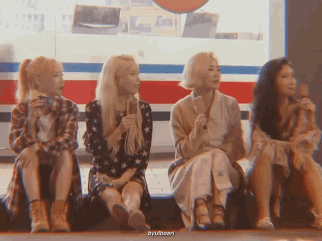 a group of four women sitting next to each other with the caption byulbaeri
