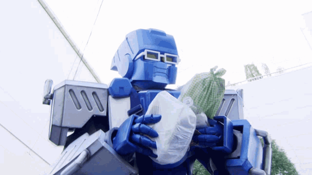 a robot is holding a bag of food in his hands