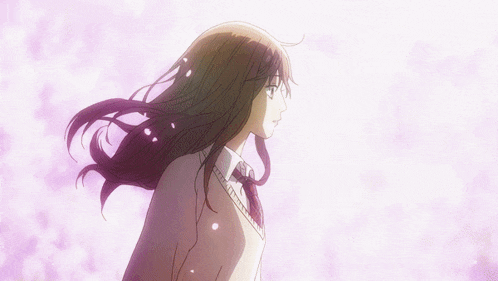 a girl with long brown hair is standing in front of a purple background