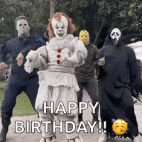 a group of people in halloween costumes are dancing in a park and saying `` happy birthday '' .