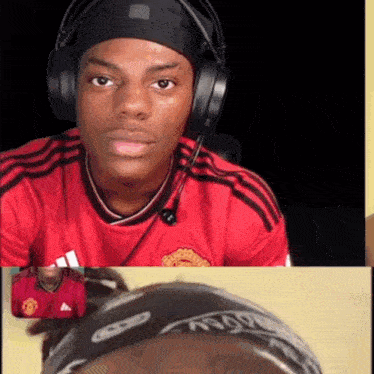a man wearing headphones and a red manchester united jersey
