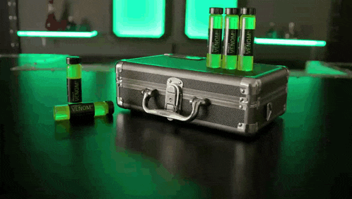 a briefcase with three bottles of venom on it