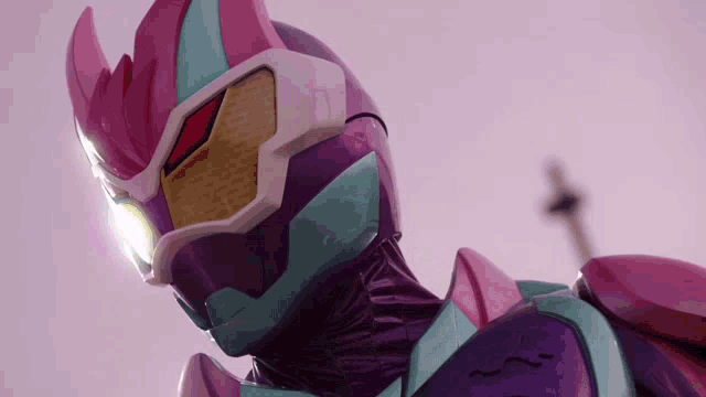 a close up of a purple and pink costume