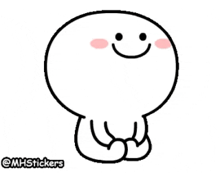 a cartoon character with a smiley face is sitting down with his hands folded .
