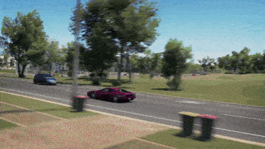 a purple car is driving down a street next to a trash can