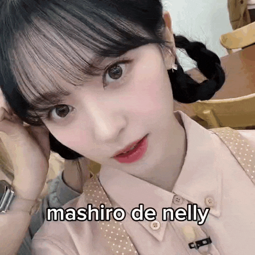 a close up of a woman 's face with the words mashiro de nelly written on the bottom
