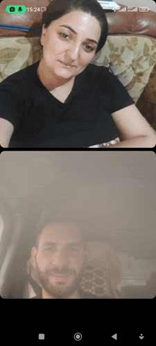 a man and a woman are having a video call on their cell phone