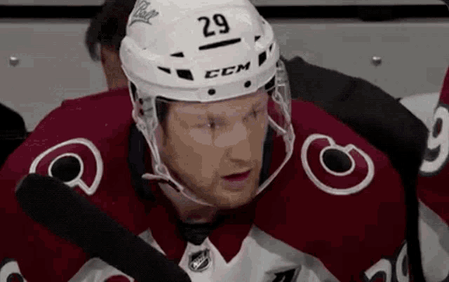 a hockey player wearing a helmet that says ccm on it
