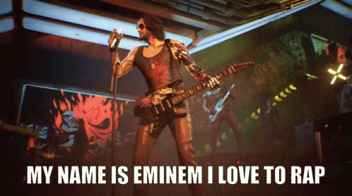 a man singing into a microphone with the words my name is eminem i love to rap underneath him