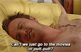 a shirtless man is laying on a bed with the words " can 't we just go to the movies or putt-putt "