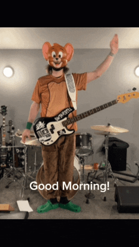 a man in a jerry mouse costume is holding a guitar