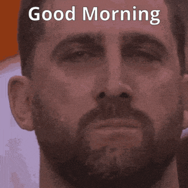 a close up of a man 's face with the words " good morning " above him