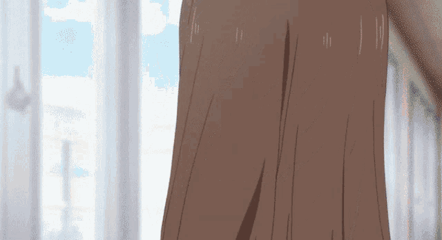 a close up of a person 's hair with a window behind them