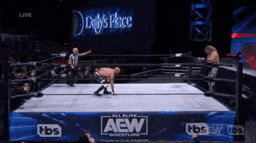 a wrestler in a ring that says aew