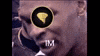 a close up of a man 's face with a circle around his eye and a tm logo .