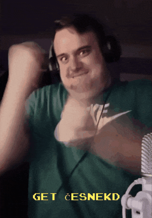 a man wearing headphones and a green shirt with the words get cesnekd on it