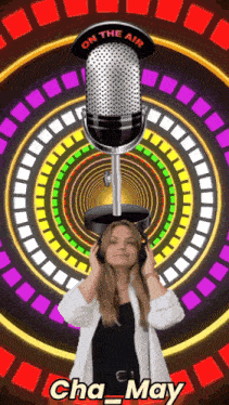 a woman wearing headphones stands in front of a microphone with the words on the air above it